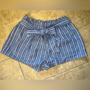 Love Tree brand paper bag waist shorts with bow tie around the waist.